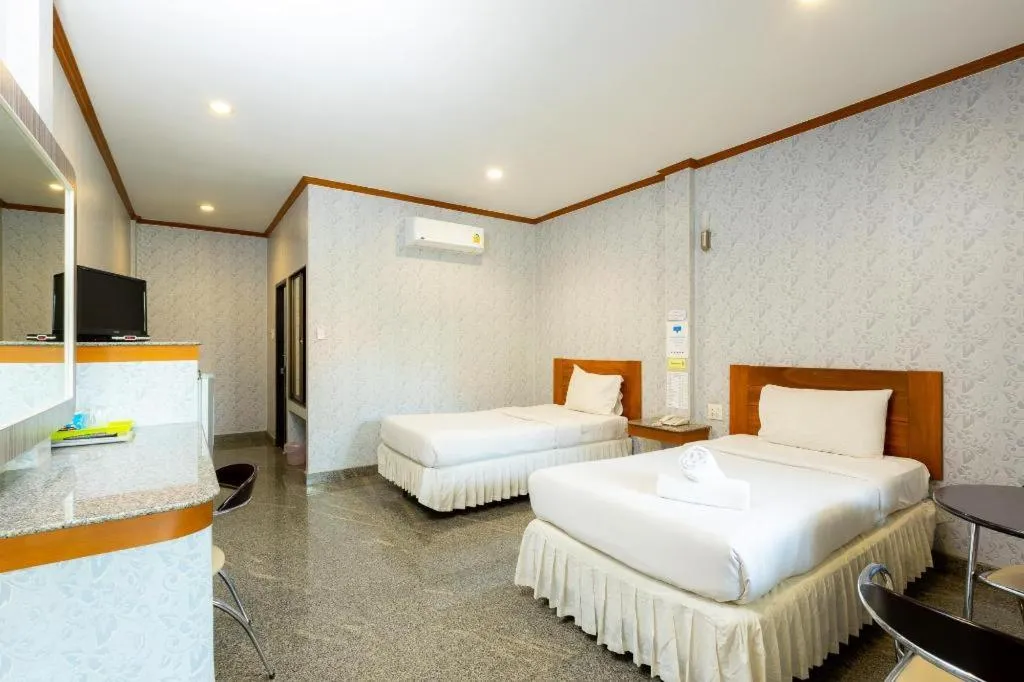 Bed in Manee Sangkha Hotel