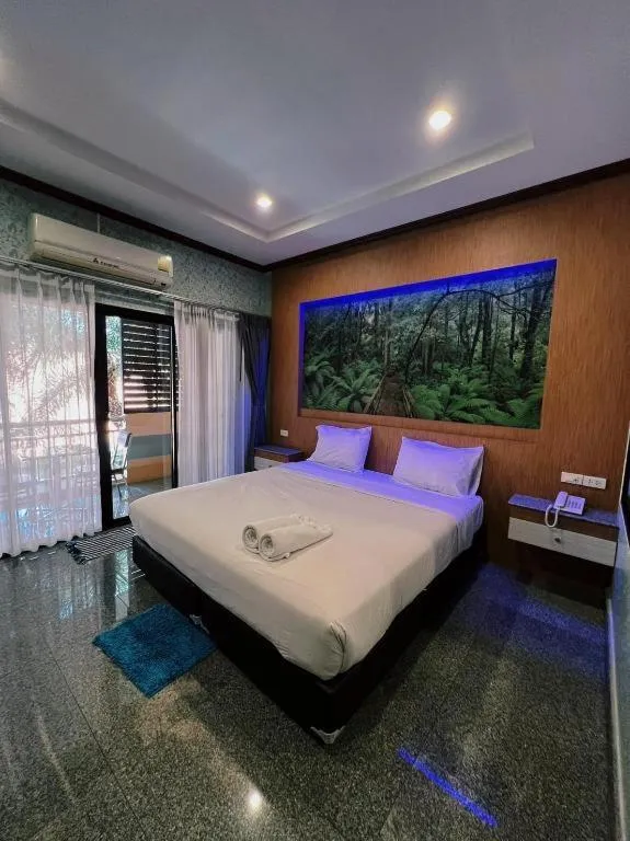 Bed in Manee Sangkha Hotel