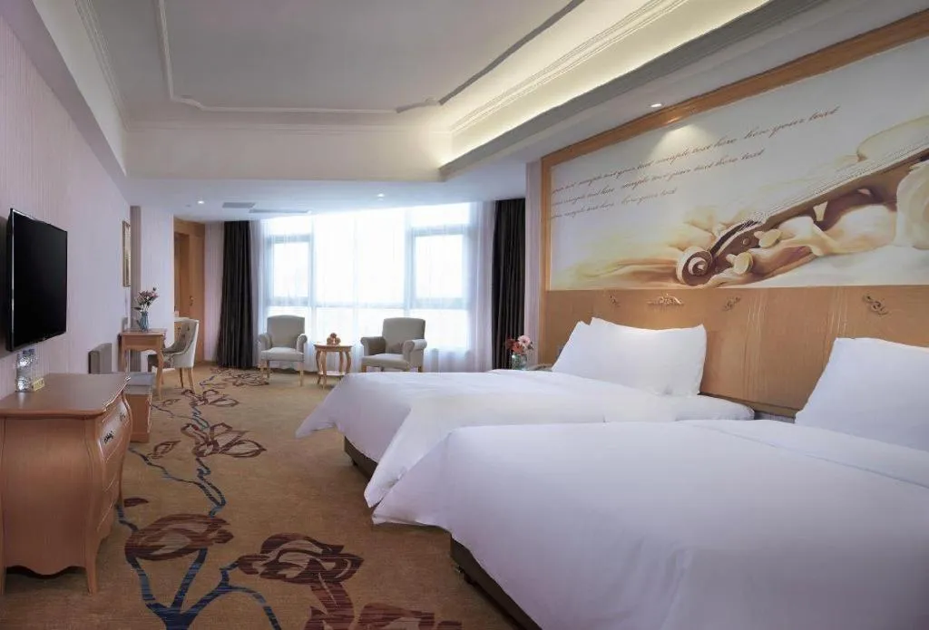Bed in Vienna Hotel Guangdong Xinyi Jiaoyucheng River View