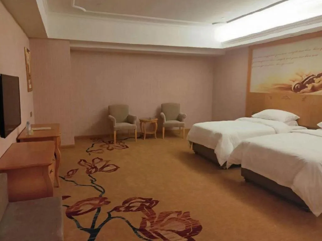 Bed in Vienna Hotel Guangdong Xinyi Jiaoyucheng River View
