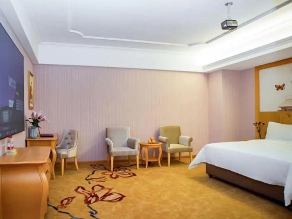Bed in Vienna Hotel Guangdong Xinyi Jiaoyucheng River View