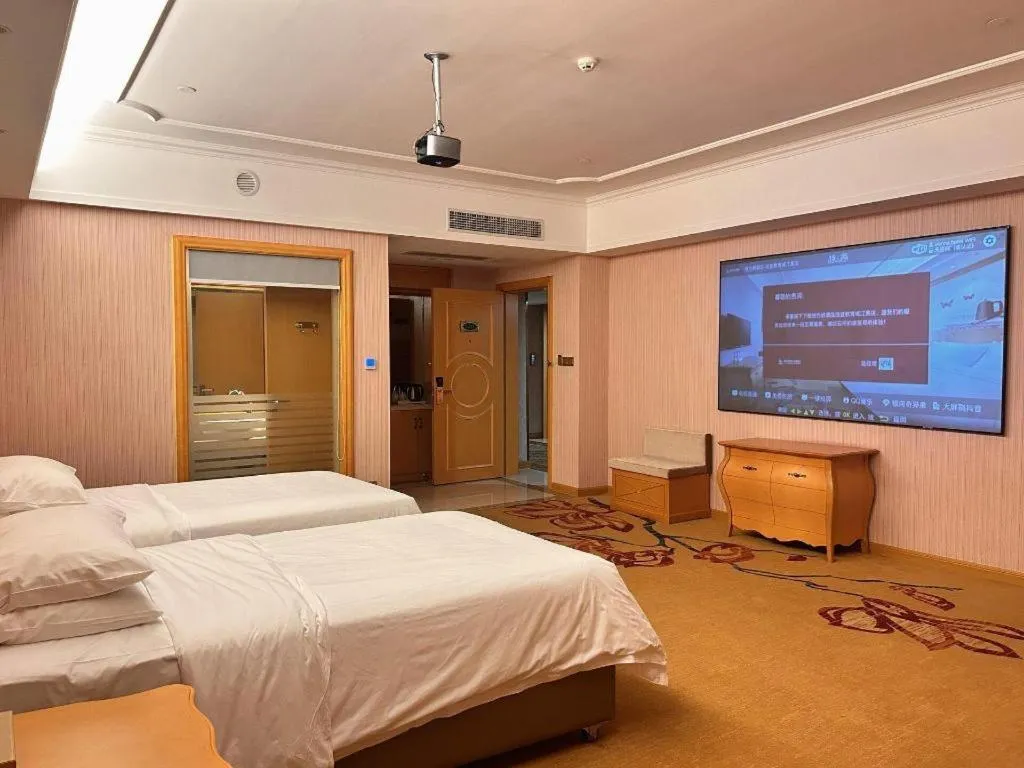 Bed in Vienna Hotel Guangdong Xinyi Jiaoyucheng River View