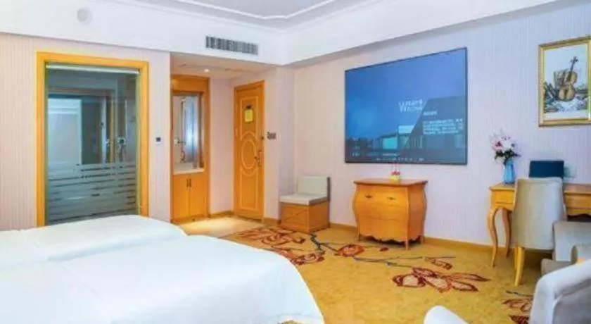 Bed in Vienna Hotel Guangdong Xinyi Jiaoyucheng River View
