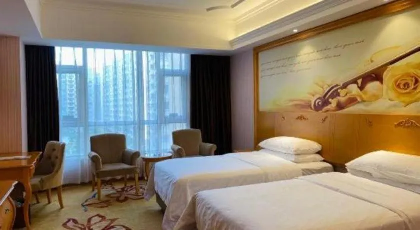 Bed in Vienna Hotel Guangdong Xinyi Jiaoyucheng River View
