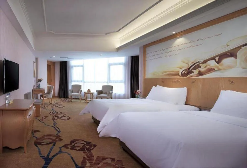 Bed in Vienna Hotel Guangdong Xinyi Jiaoyucheng River View