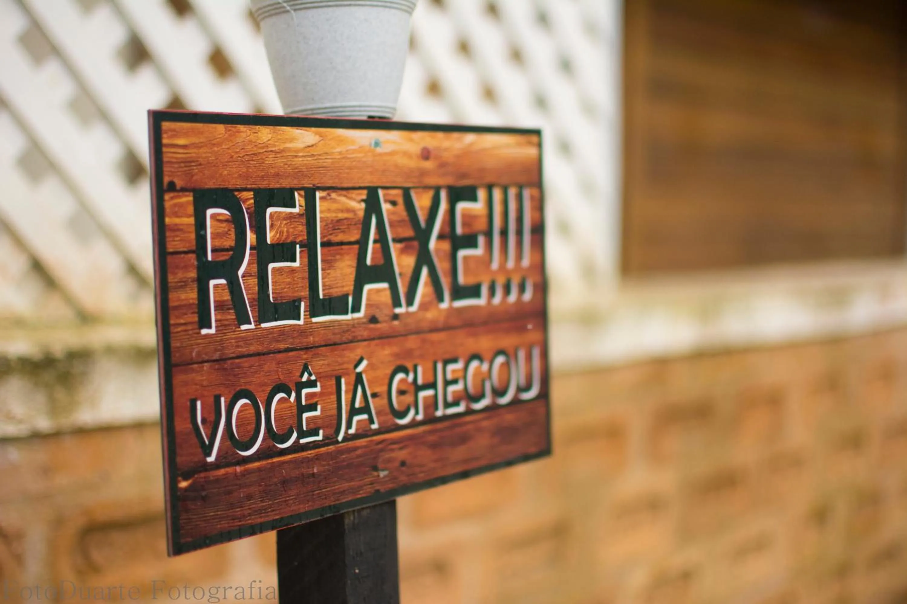 Text overlay in Pousada Recanto Ninho Verde Chalés
