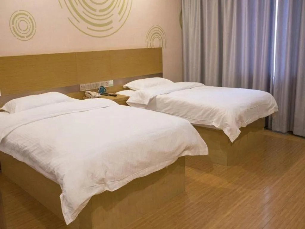 Bed in GreenTree Inn Qingdao Jiaozhou Jiaoping Road Express Hotel