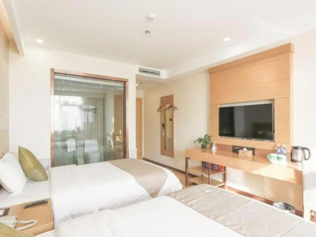 Bed in GreenTree Inn Zhangjiagang Yangshe Old Street Stadium