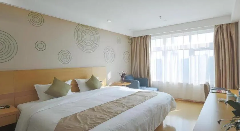 Bed in GreenTree Inn Zhangjiagang Yangshe Old Street Stadium