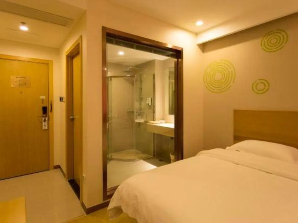 Bed in GreenTree Inn Zhangjiagang Yangshe Old Street Stadium