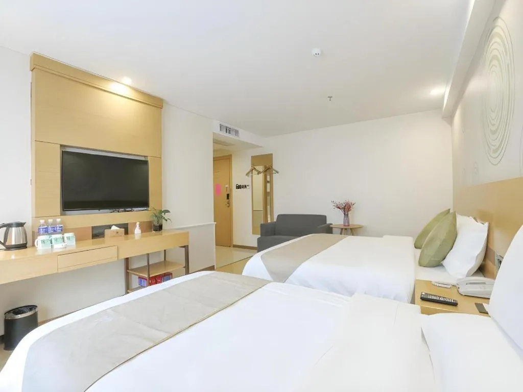 Bed in GreenTree Inn Zhangjiagang Yangshe Old Street Stadium