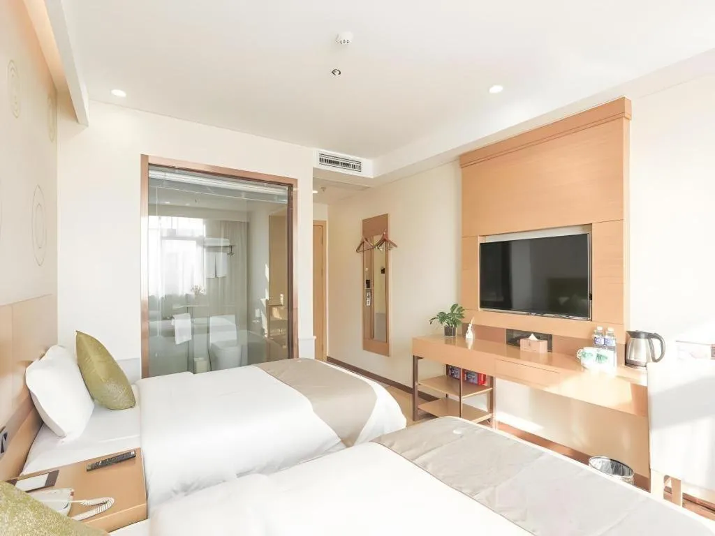 Bed in GreenTree Inn Zhangjiagang Yangshe Old Street Stadium