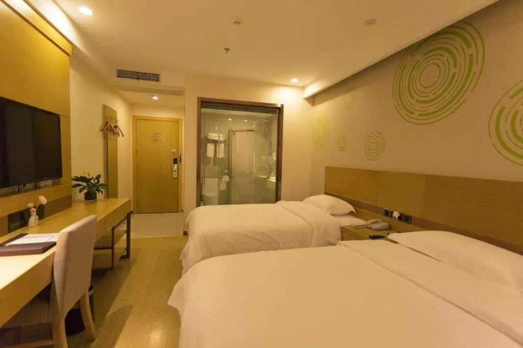 Bed in GreenTree Inn Zhangjiagang Yangshe Old Street Stadium