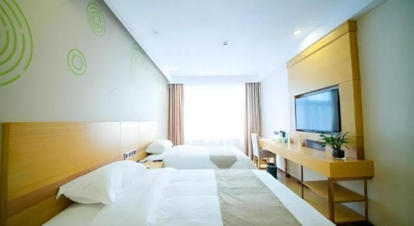 Bed in GreenTree Inn Zhangjiagang Yangshe Old Street Stadium