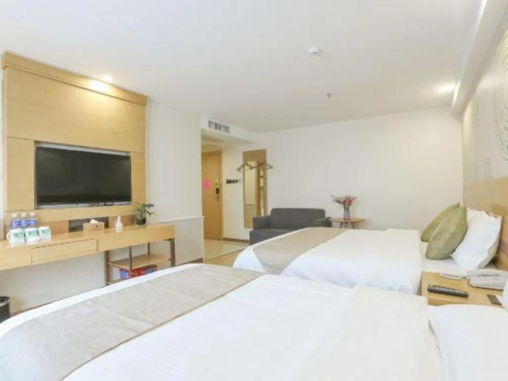 Bed in GreenTree Inn Zhangjiagang Yangshe Old Street Stadium