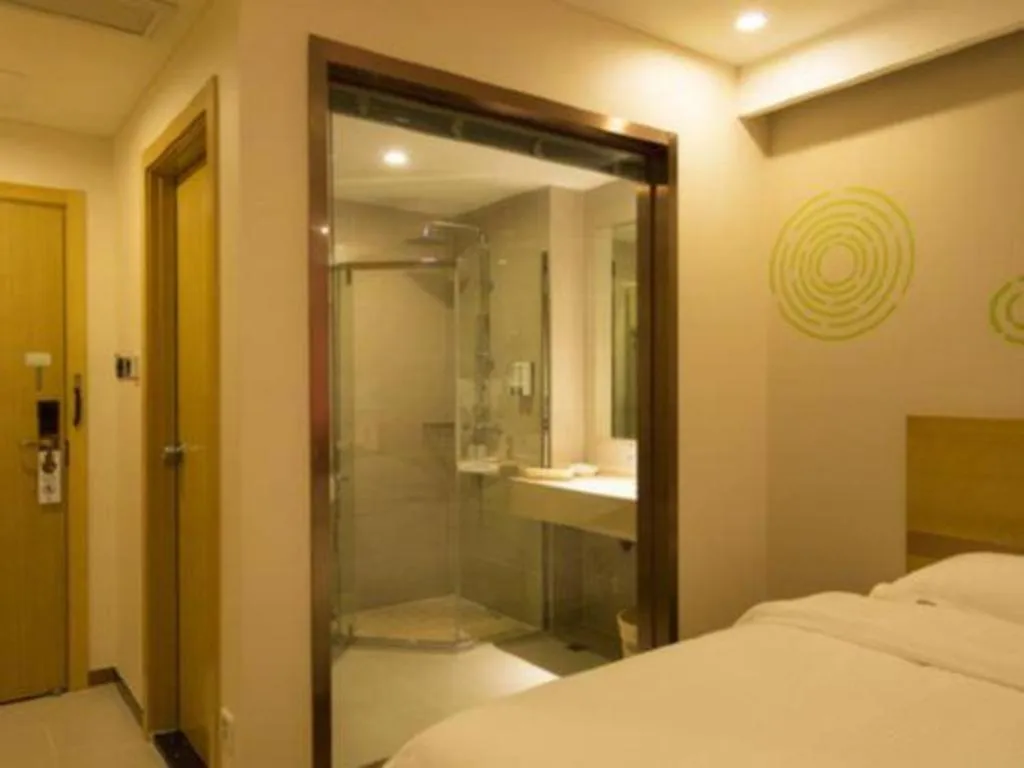 Bed in GreenTree Inn Zhangjiagang Yangshe Old Street Stadium