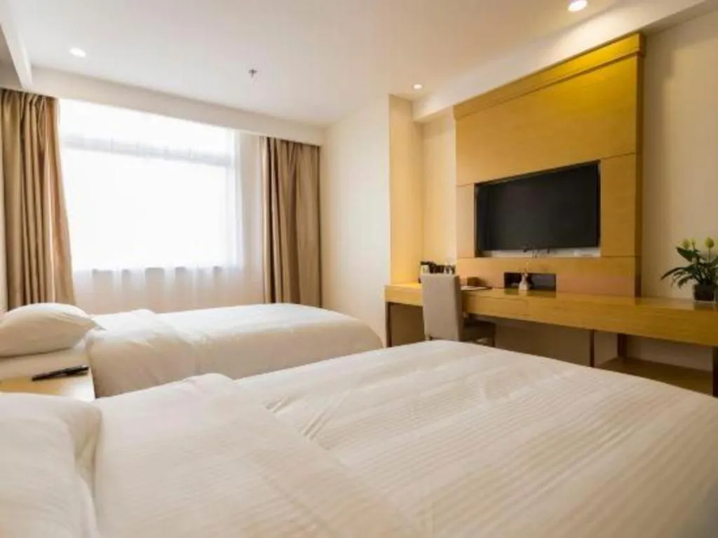 Bed in GreenTree Inn Zhangjiagang Yangshe Old Street Stadium