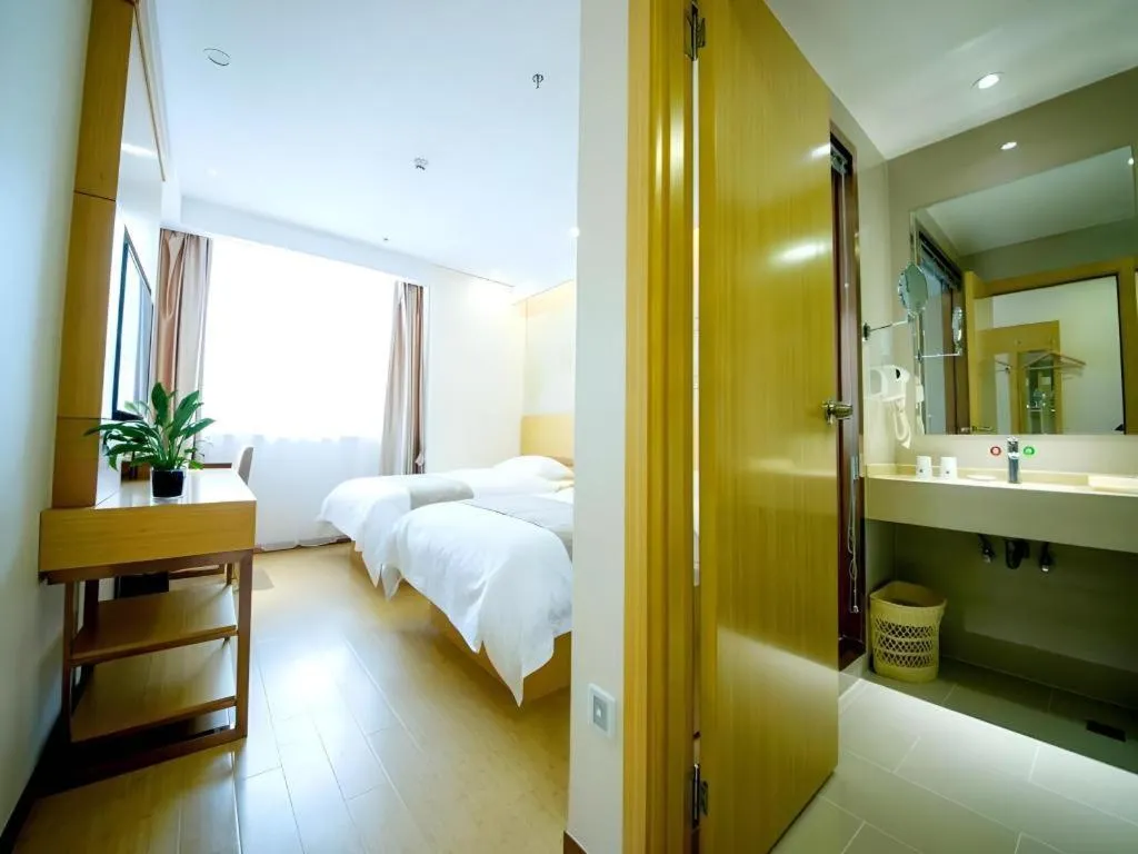 Bed in GreenTree Inn Zhangjiagang Yangshe Old Street Stadium