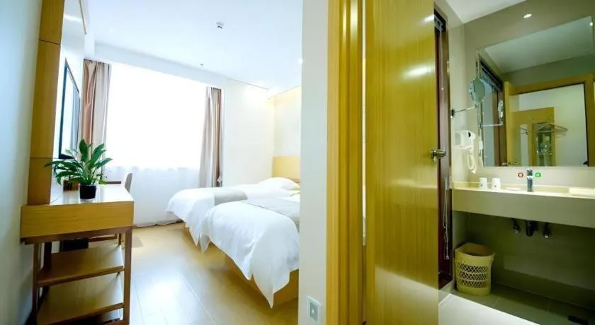 Bed in GreenTree Inn Zhangjiagang Yangshe Old Street Stadium