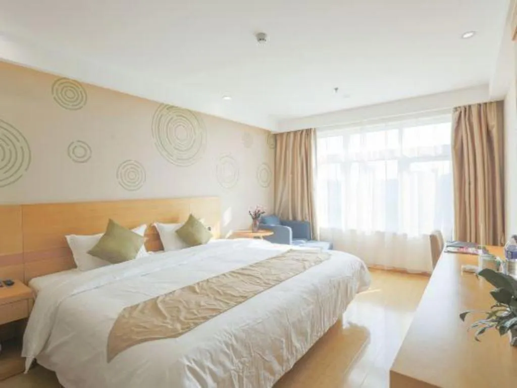 Bed in GreenTree Inn Zhangjiagang Yangshe Old Street Stadium