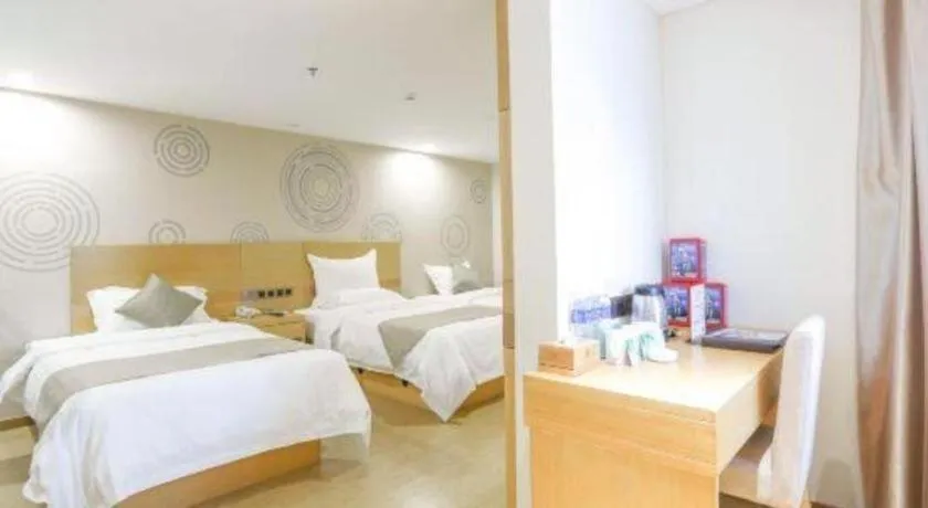 Bed in GreenTree Inn Zhangjiagang Yangshe Old Street Stadium