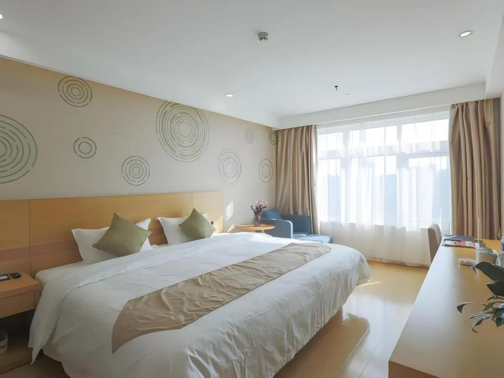 Bed in GreenTree Inn Zhangjiagang Yangshe Old Street Stadium