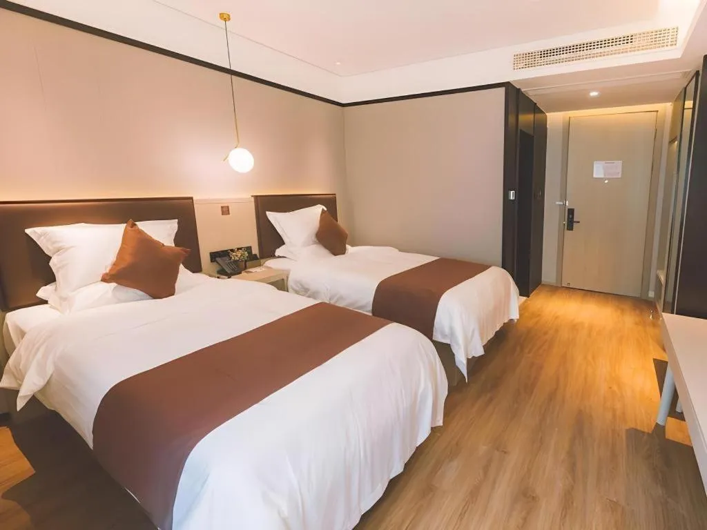 Bed in GYA Shanghai Jiangpu Hotel