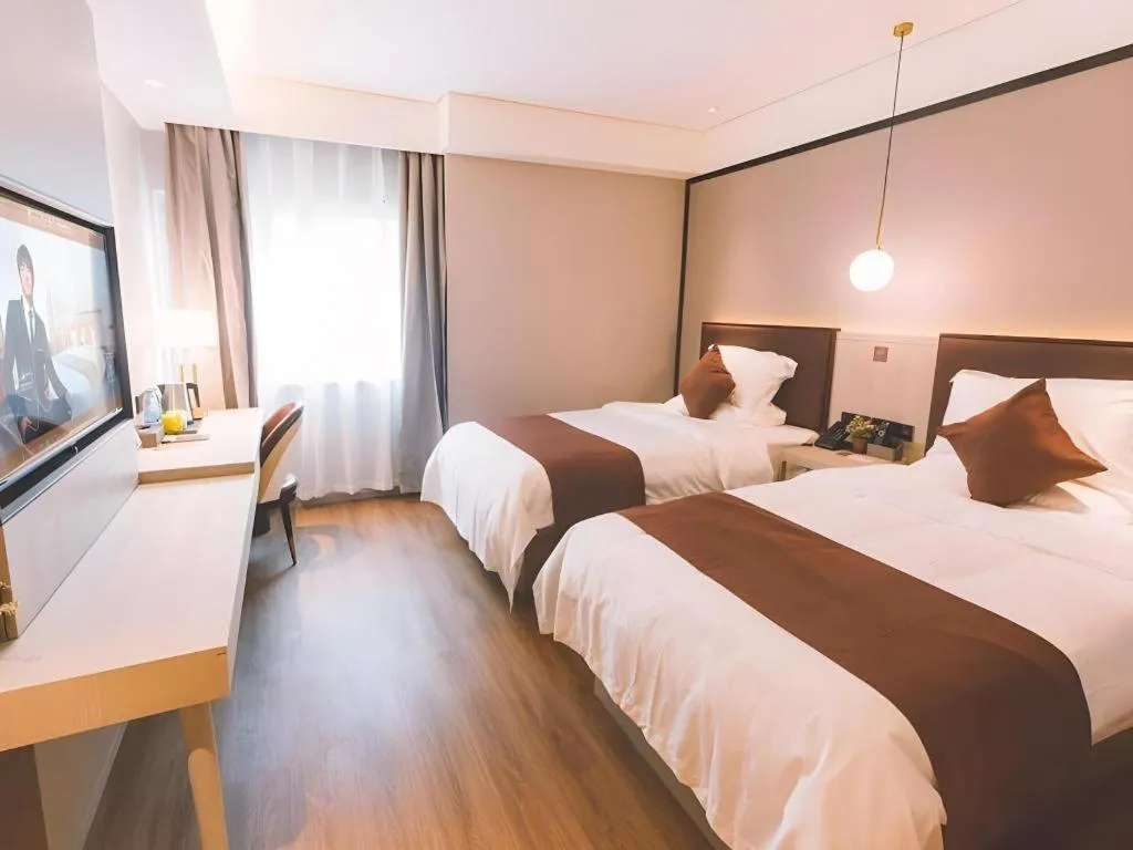 Bed in GYA Shanghai Jiangpu Hotel