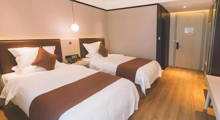 Bed in GYA Shanghai Jiangpu Hotel