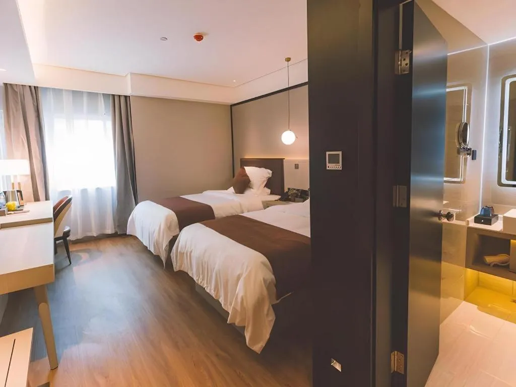 Bed in GYA Shanghai Jiangpu Hotel