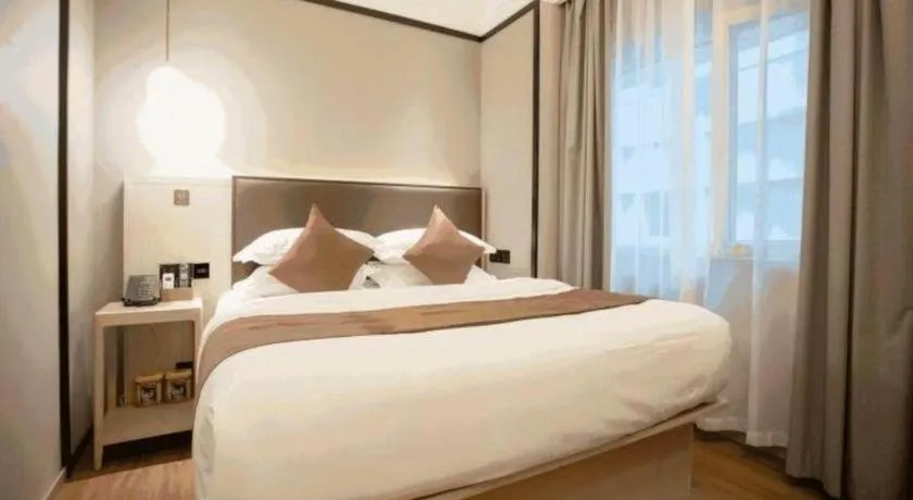 Bed in GYA Shanghai Jiangpu Hotel