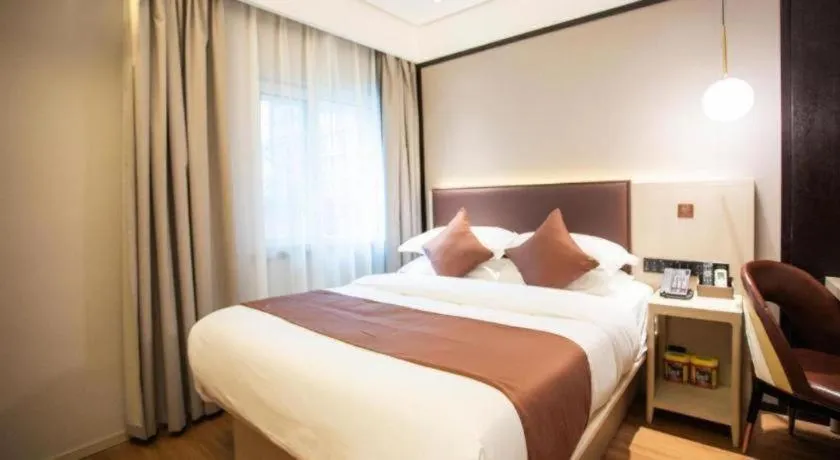Bed in GYA Shanghai Jiangpu Hotel