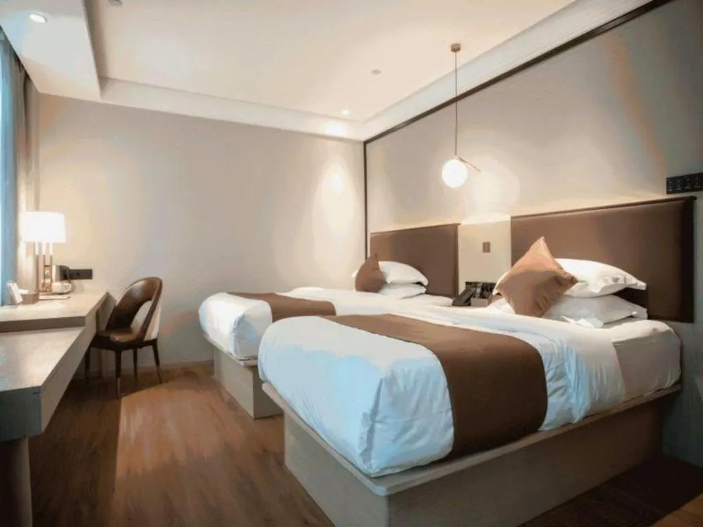 Bed in GYA Shanghai Jiangpu Hotel