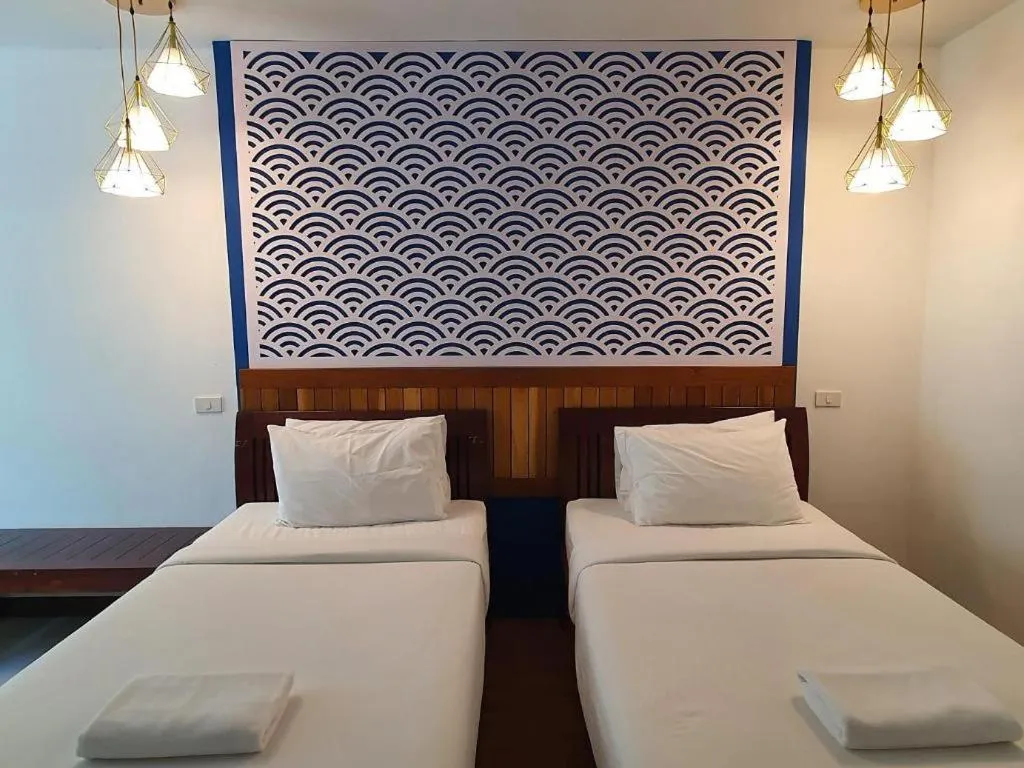 Bed in Rattana Pura Beach Resort