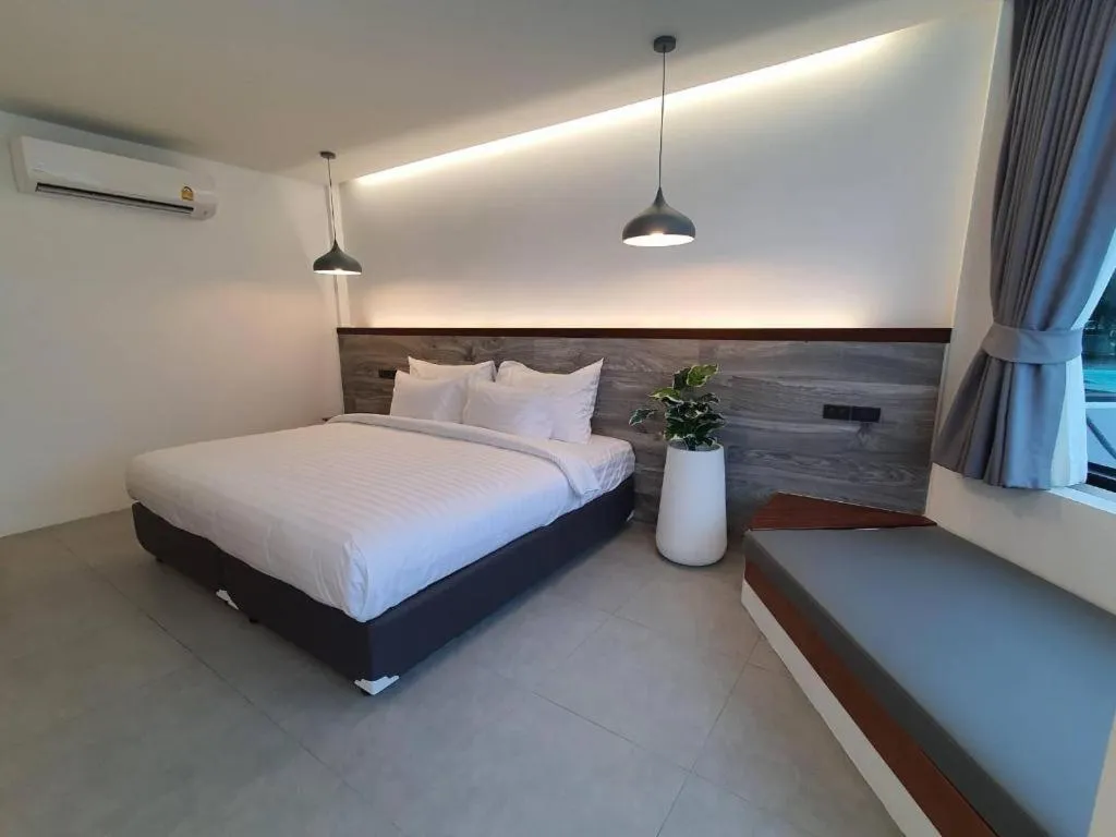 Bed in Rattana Pura Beach Resort