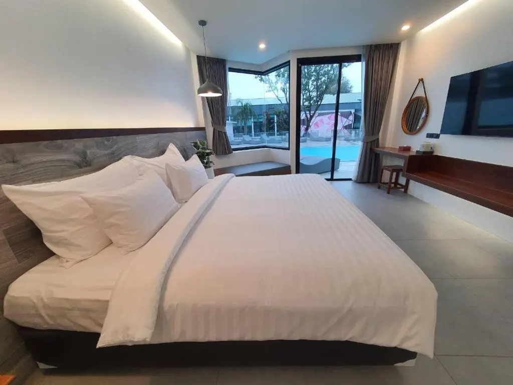 Bed in Rattana Pura Beach Resort