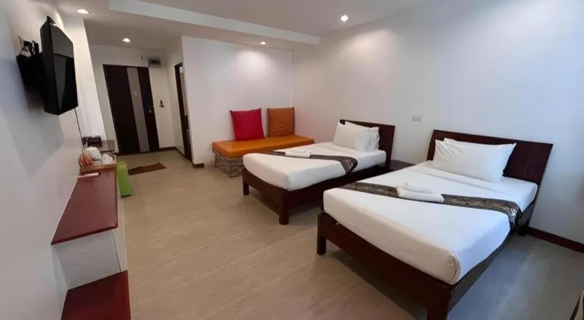 Bed in Rattana Pura Beach Resort