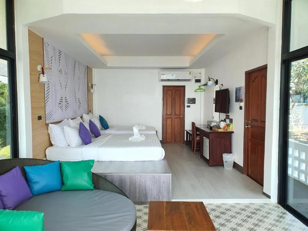 Bed in Rattana Pura Beach Resort