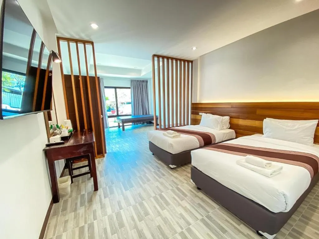 Bed in Rattana Pura Beach Resort