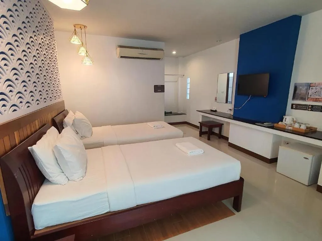 Bed in Rattana Pura Beach Resort