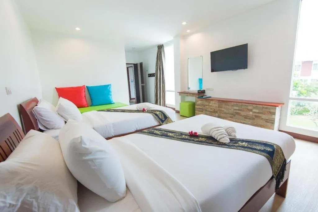 Bed in Rattana Pura Beach Resort