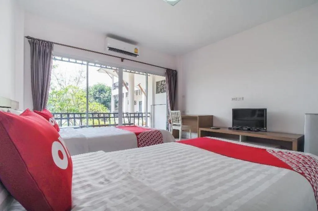 Bed in Super OYO 662 Malee Bunga Hotel