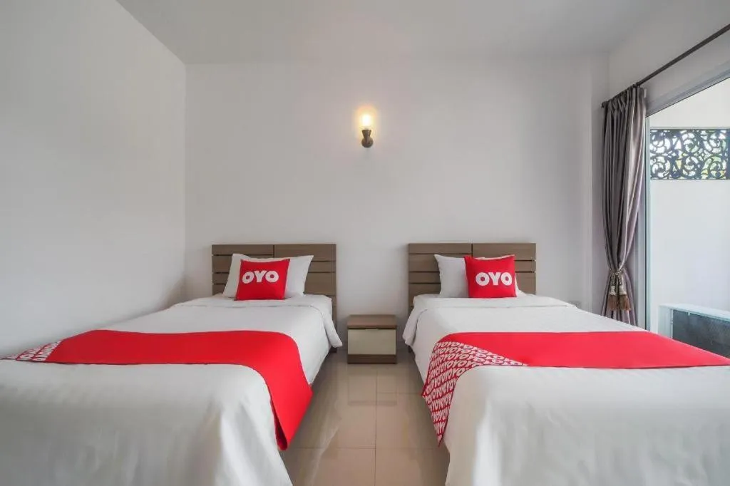 Bed in Super OYO 662 Malee Bunga Hotel
