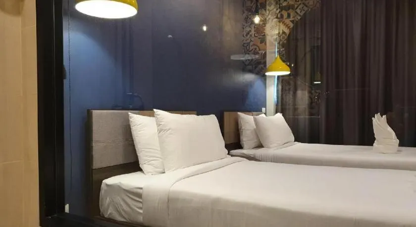 Bed in THE S VILLAS HOTEL