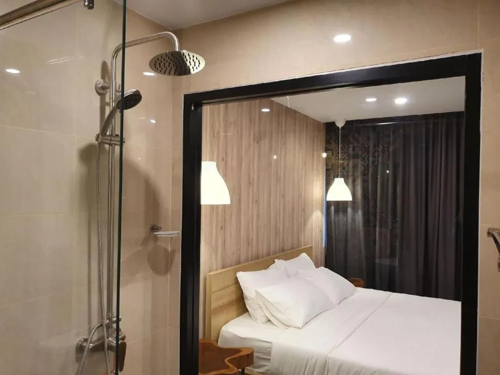 Bed in THE S VILLAS HOTEL