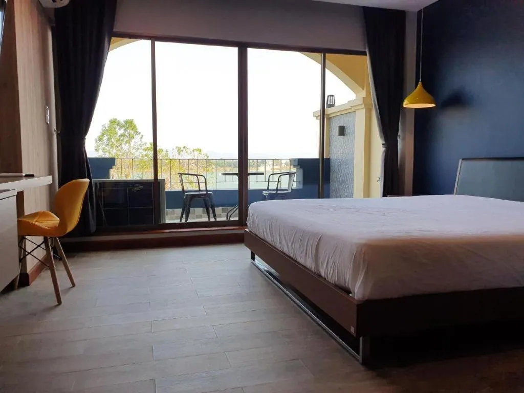 Bed in THE S VILLAS HOTEL