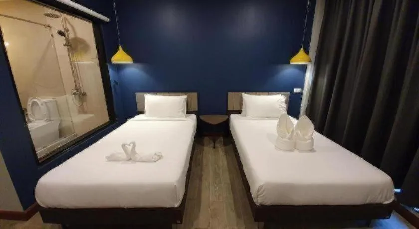 Bed in THE S VILLAS HOTEL