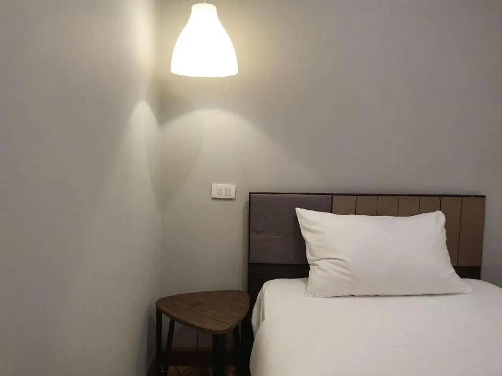 Bed in THE S VILLAS HOTEL