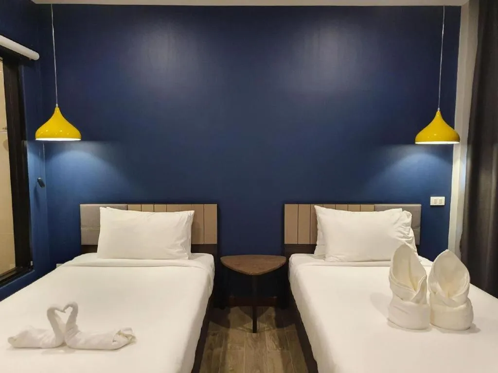 Bed in THE S VILLAS HOTEL