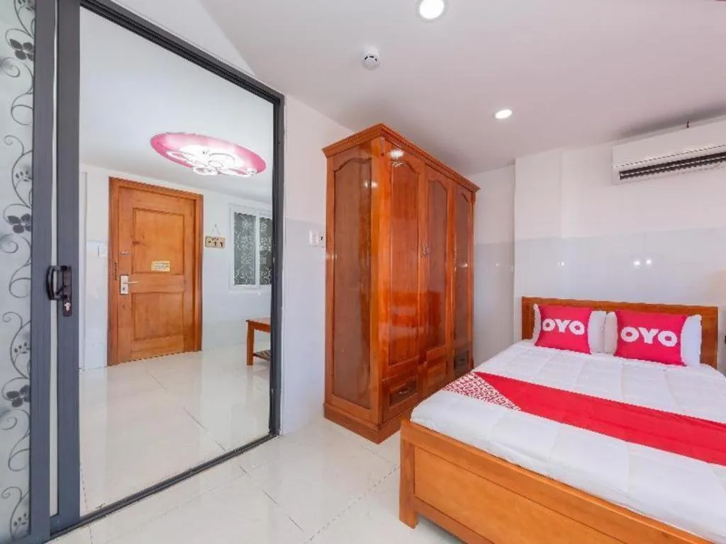 Bed in OYO 1028 Flower House Apartment